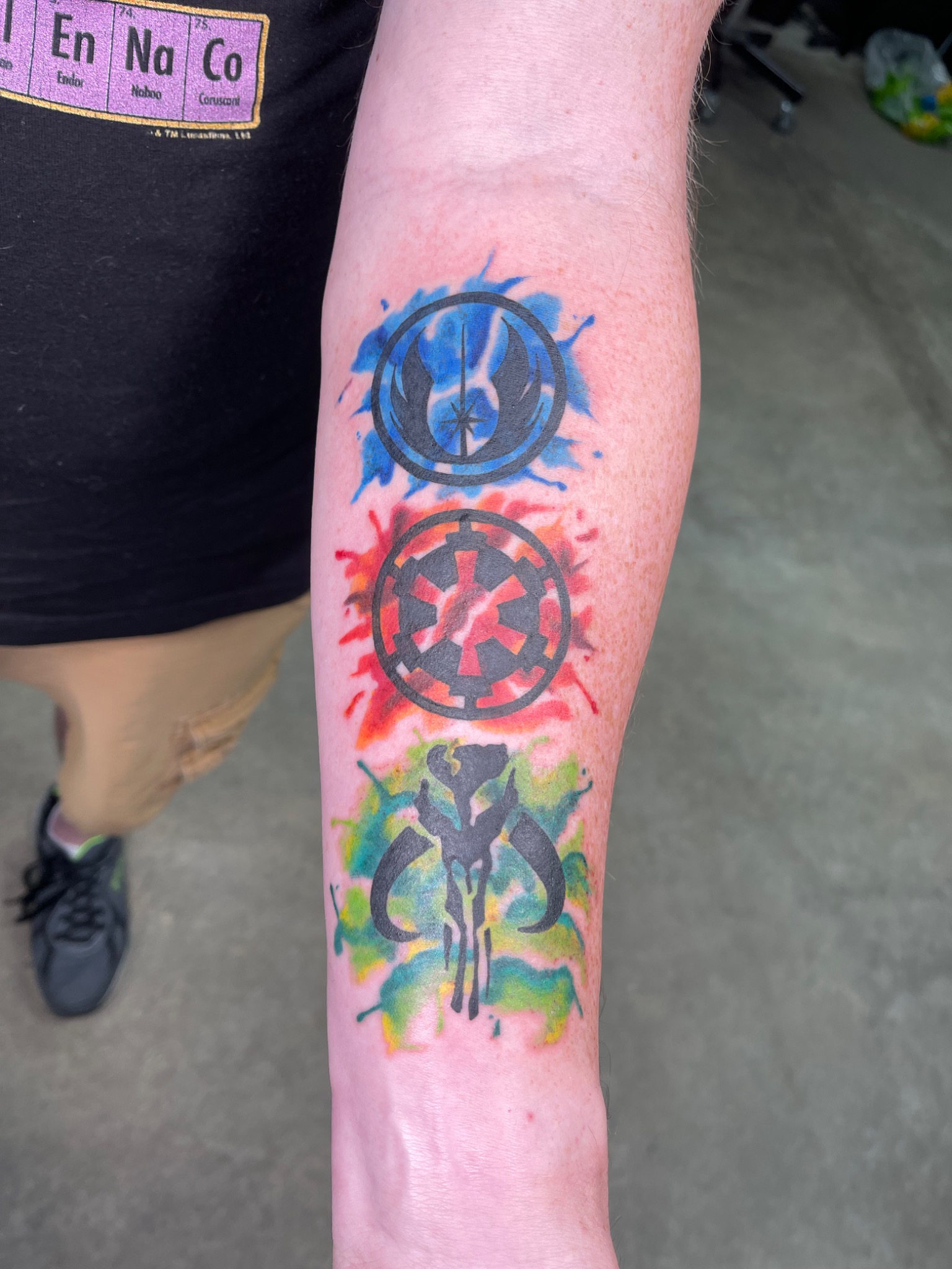 Color three-part forearm tattoo