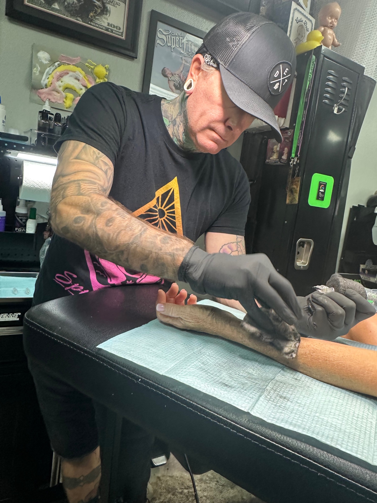 Paul working with a client at Ink Ink Tattoos