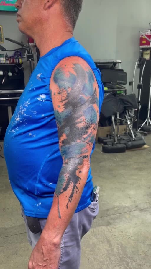 Large color upper-arm and sleeve tattoo