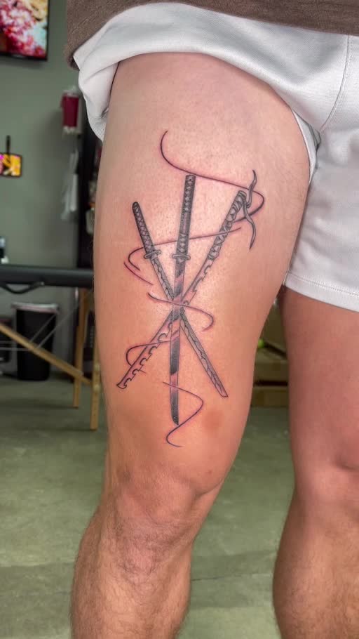 Fine-line crossed swords tattoo