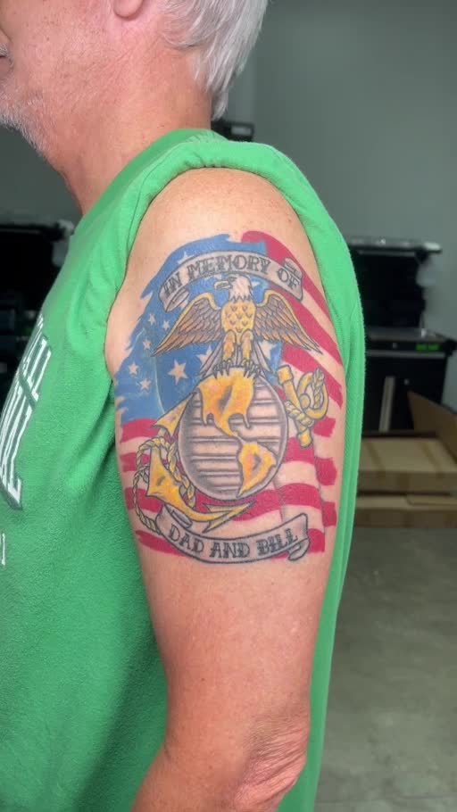 Color military themed upper-arm tattoo